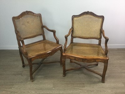 Lot 1407 - A PAIR OF 19TH CENTURY FRENCH PROVINCIAL WALNUT OPEN ELBOW CHAIRS