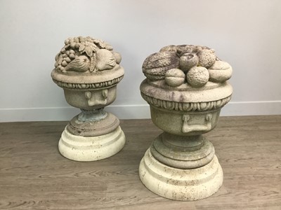Lot 1428 - A PAIR OF SMALL STONE GARDEN URNS