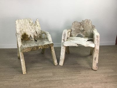 Lot 1427 - A SET OF WEATHERED RUSTIC GARDEN FURNITURE