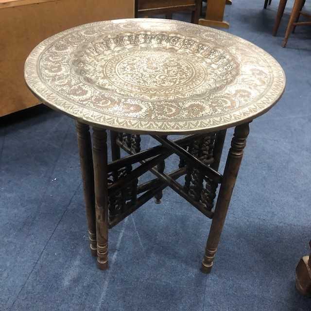 Lot 82 - AN EASTERN BRASS TOPPED TABLE