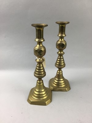 Lot 436 - A PAIR OF BRASS CANDLESTICKS, TWO BRASS OIL LAMPS AND ANOTHER BRASS ITEM