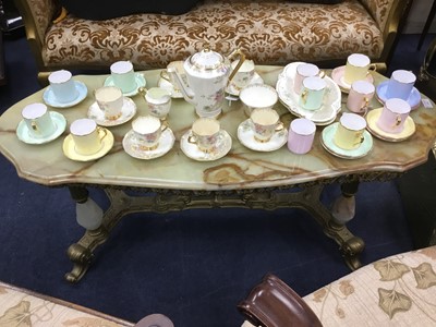 Lot 470 - A BRASS COFFEE TABLE WITH ONYX TOP