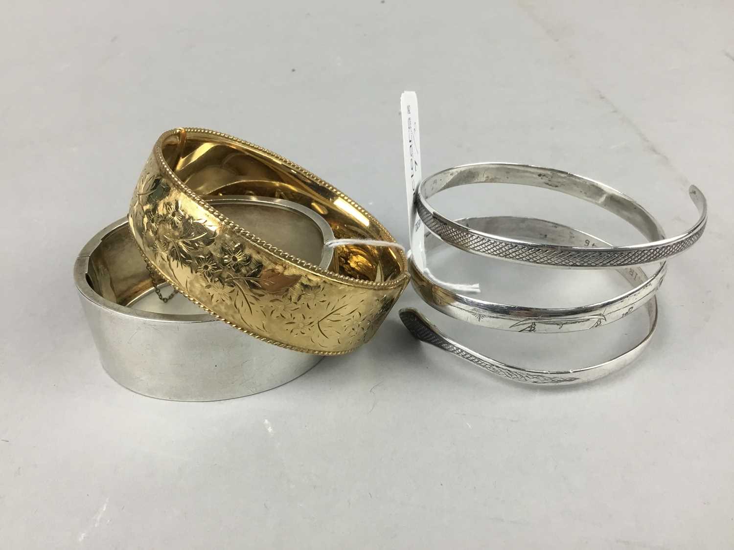 Lot 7 - A VICTORIAN SILVER BANGLE AND TWO OTHERS