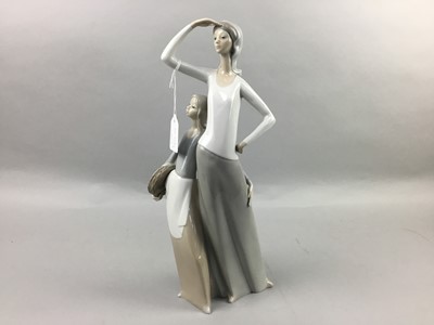 Lot 550 - A LLADRO GIRL WITH GOOSE AND GOSLING GROUP ANOTHER LLADRO FIGURE AND A NAO FIGURE