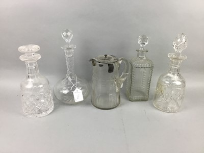 Lot 506 - A CUT GLASS WATER JUG AND FOUR DECANTERS AND STOPPERS