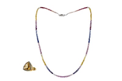 Lot 455 - A SAPPHIRE BEAD NECKLACE AND A CITRINE RING