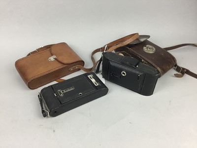 Lot 125 - A VOIGTLANDER FOLDING CAMERA AND OTHERS