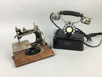 Lot 206 - A VINTAGE TELEPHONE AND A SEWING MACHINE