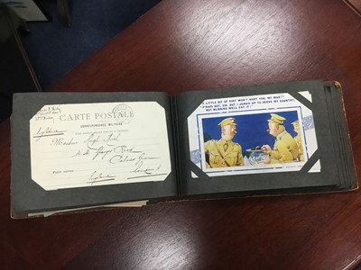Lot 214 - A LOT OF TWO ALBUMS OF VINTAGE MILITARY POSTCARDS