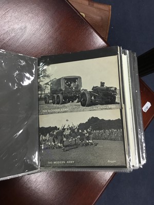 Lot 214 - A LOT OF TWO ALBUMS OF VINTAGE MILITARY POSTCARDS