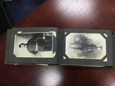 Lot 214 - A LOT OF TWO ALBUMS OF VINTAGE MILITARY POSTCARDS