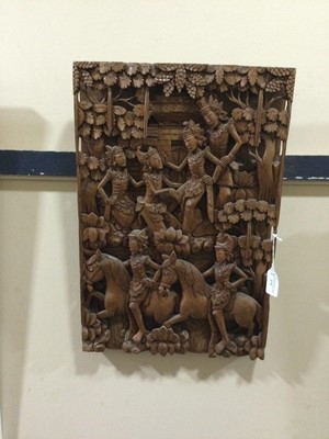 Lot 273 - AN INDONESIAN CARVED WOOD RECTANGULAR PLAQUE