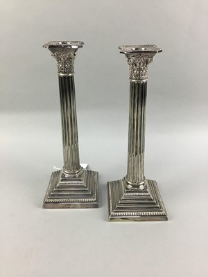 Lot 345 - A PAIR OF SILVER PLATED WALKER & HALL COLUMN CANDLESTICKS