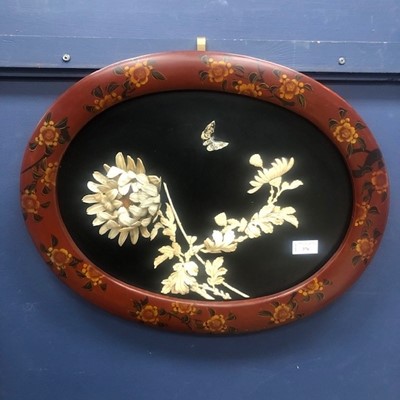 Lot 376 - A JAPANESE OVAL BLACK LACQUERED PANEL