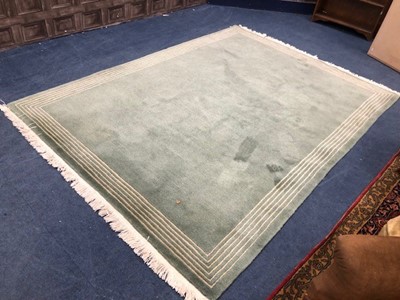 Lot 411 - A MODERN GREEN RUG