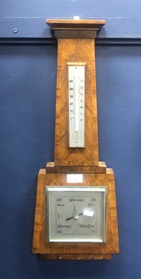 Lot 452 - A WALNUT WALL BAROMETER