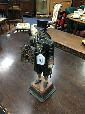 Lot 622 - A FIGURAL TIN PLATE CLOCK