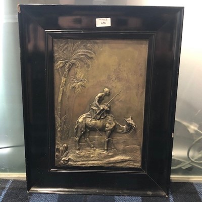 Lot 628 - A FRAMED EMBOSSED SILVERED METAL WALL PLAQUE