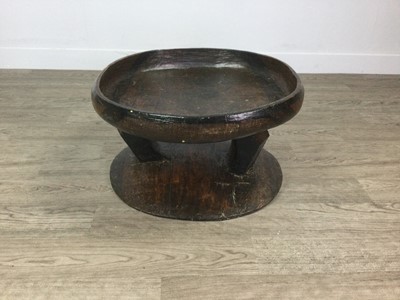 Lot 902 - AN AFRICAN CARVED WOOD TABLE