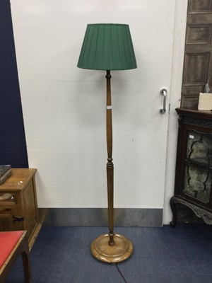 Lot 692 - A WALNUT STANDARD LAMP