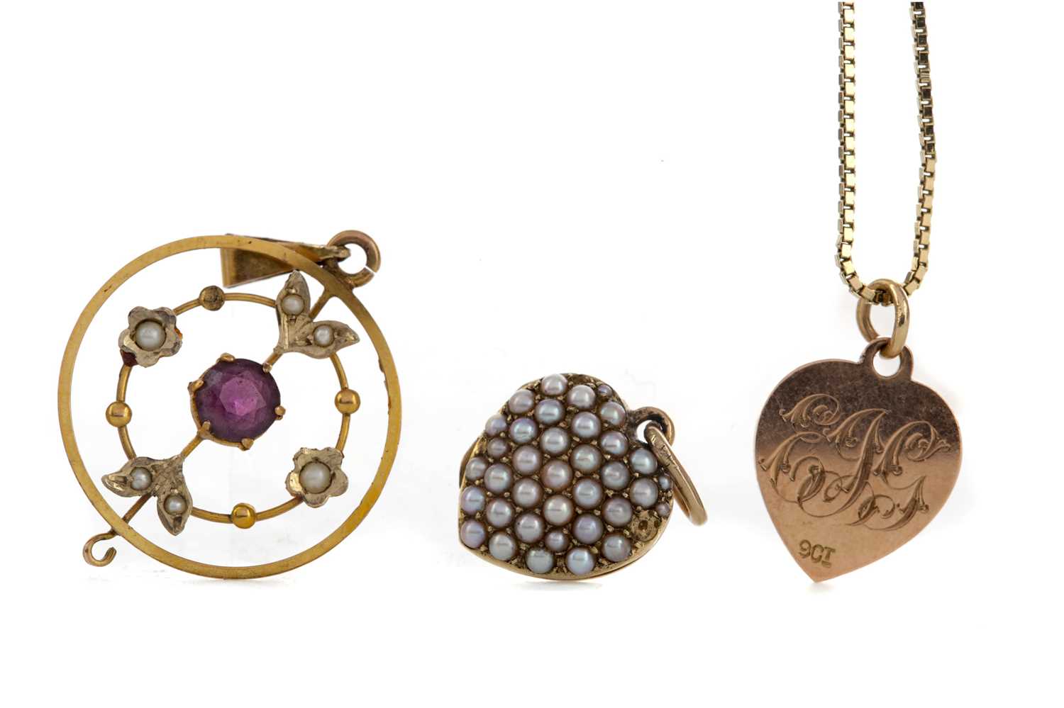 Lot 1314 - TWO HEART PENDANTS AND AN AMETHYST AND SEED PEARL PENDANT