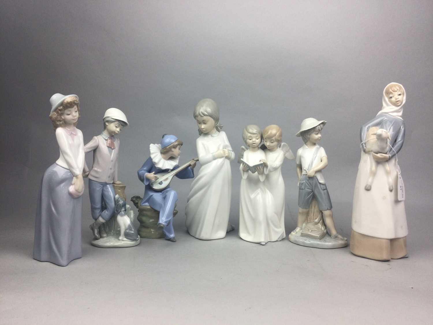 Lot 37 - A LLADRO FIGURE OF A GIRL WITH A LAMB AND FIVE OTHER FIGURES