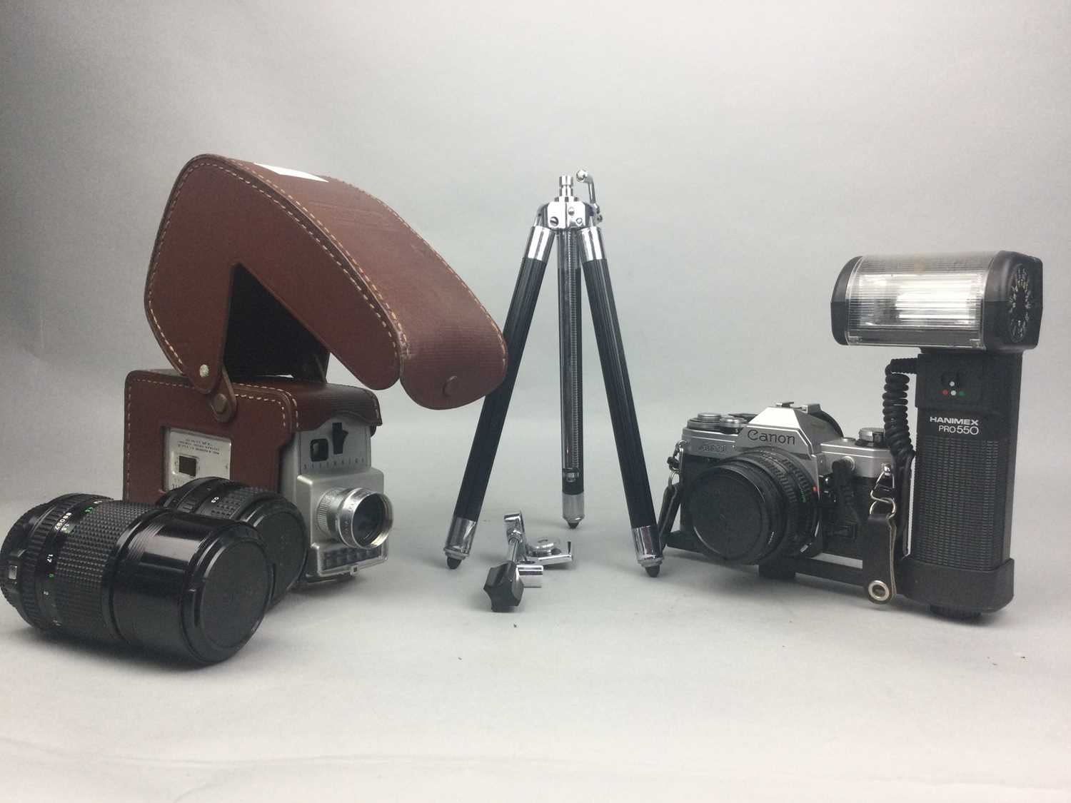 Lot 65 - A LOT OF TWO CAMERAS, TWO LENSES AND A TRIPOD STAND