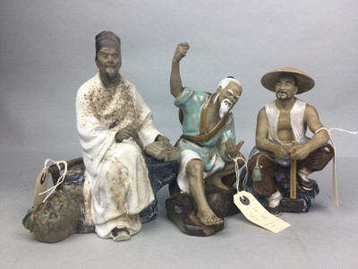 Lot 129 - A LOT OF THREE CHINESE GLAZED POTTERY SEATED FIGURES