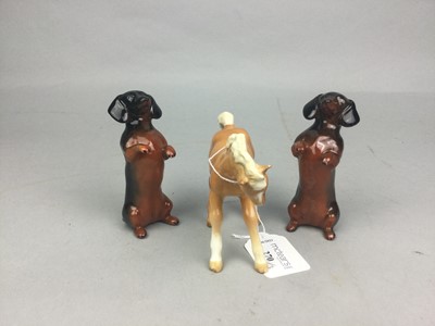 Lot 270 - A PAIR OF BESWICK DACHSHUNDS, ALONG WITH A FOAL