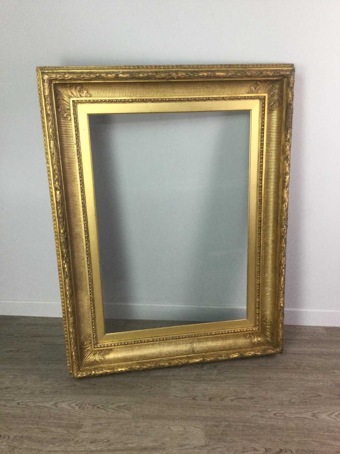 Lot 1681 - A LATE VICTORIAN GILTWOOD PICTURE FRAME