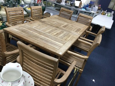 Lot 494 - A CONTEMPORARY HARDWOOD EXTENDING GARDEN DINING TABLE AND EIGHT ARMCHAIRS