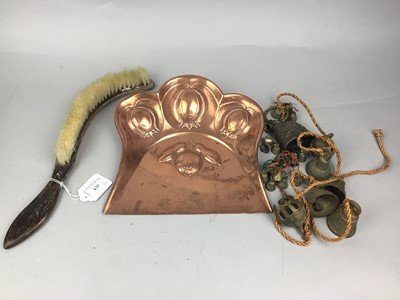 Lot 435 - A GROUP OF BRASS COW BELLS AND A COPPER CRUMB TRAY AND BRUSH