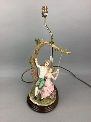 Lot 394 - CAPODIMONTE FIGURAL TABLE LAMP, ANOTHER TABLE LAMP, A NUT DISH AND A FIGURE OF A DOG