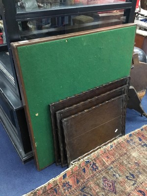 Lot 230 - AN EARLY 20TH CENTURY OAK FRAMED CARD TABLE AND A SET OF TRAYS