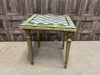 Lot 450 - AN ONYX TOPPED GAMES TABLE