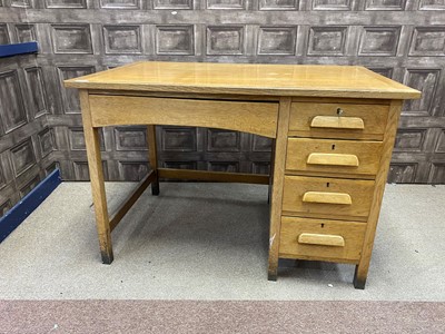 Lot 438 - AN OAK WRITING DESK