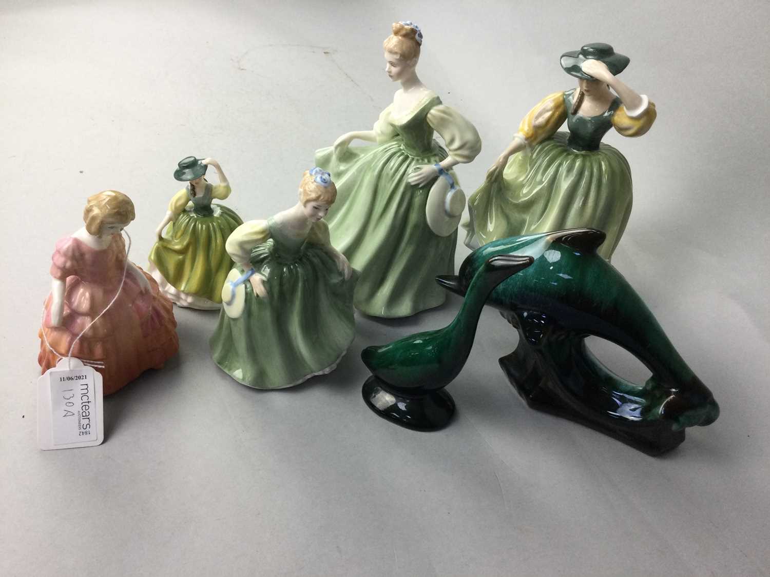 Lot 130 - A LOT OF FIVE ROYAL DOULTON FIGURES OF LADIES AND A DOLHPIN