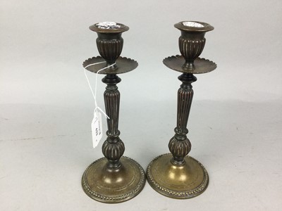 Lot 622 - A PAIR OF BRASS CANDLESTICKS