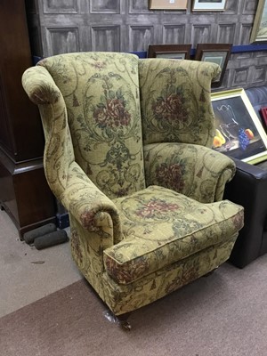 Lot 634 - A FLORAL UPHOLSTERED WING BACK ARMCHAIR