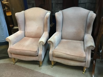 Lot 477 - A PAIR OF UPHOLSTERED WING ARMCHAIRS