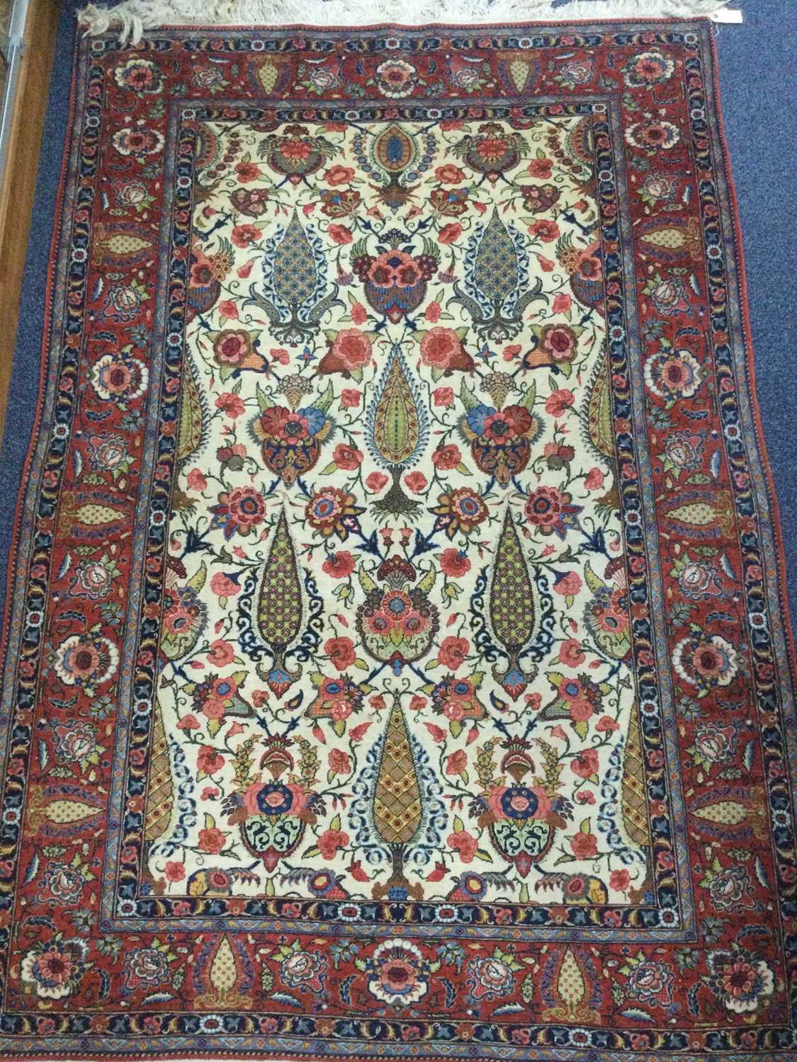 Lot 932 - A CAUCASIAN BORDERED RUG