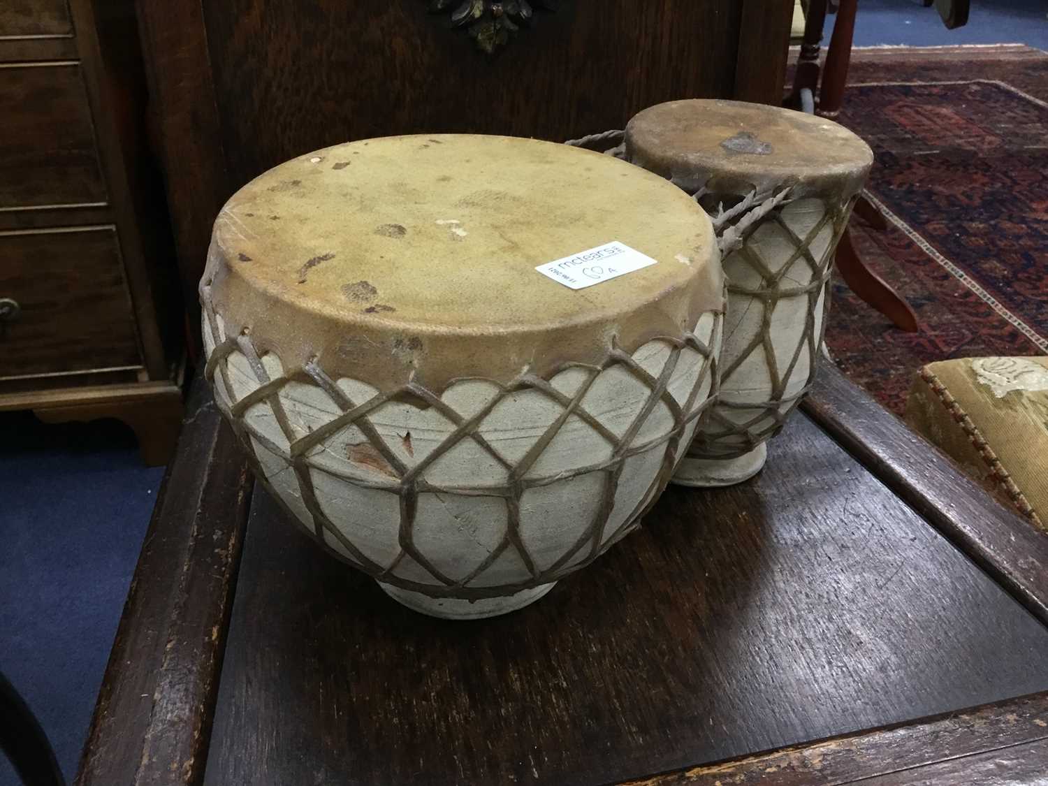 Lot 60 - A PAIR OF AFRICAN BONGO DRUMS