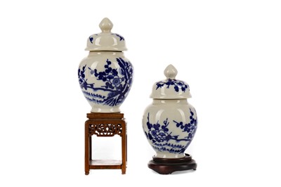 Lot 992 - A PAIR OF 20TH CENTURY CHINESE BLUE AND WHITE VASES WITH COVERS
