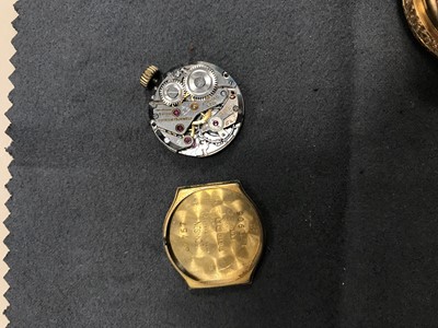 Lot 725 - A LADY'S EIGHTEEN CARAT GOLD CASED FOB WATCH AND A GOLD CASED ZODIAC WRIST WATCH
