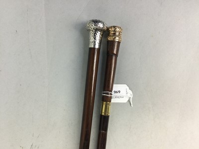 Lot 696 - A VICTORIAN SILVER TOPPED WOOD WALKING CANE AND ANOTHER CANE