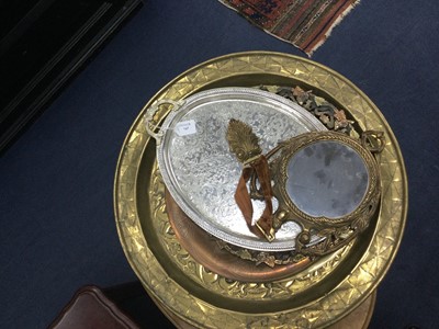 Lot 747 - A LARGE EMBOSSED BRASS CHARGER, OTHER CHARGERS AND A MIRROR