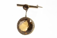 Lot 43 - EDWARDIAN FIFTEEN CARAT GOLD CITRINE BROOCH...