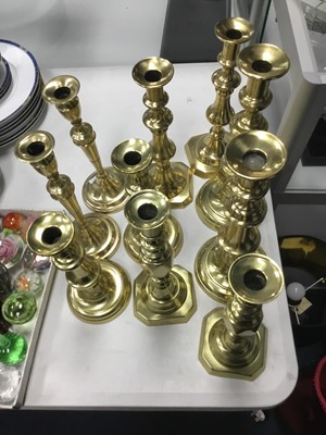 Lot 138 - A LOT OF FIVE PAIRS OF BRASS CANDLESTICKS