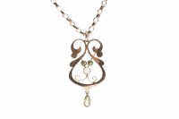 Lot 58 - EDWARDIAN NINE CARAT GOLD PENDANT set with an...