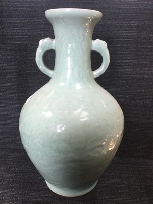 Lot 653 - A 20TH CENTURY CHINESE CELADON VASE AND A BLUE AND WHITE JAR